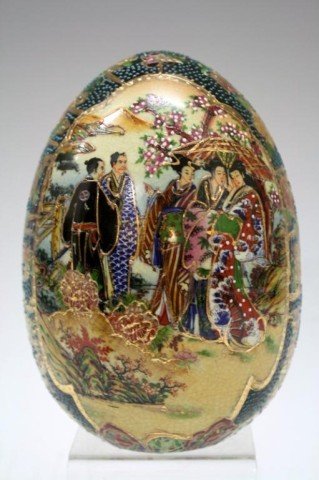 Royal Satsuma Porcelain Egg: A gold leaf, porcelain, black ground multicolor egg; marked "Hand Painted Royal Satsuma". Dimensions: 6-1/2" H x 4-1/2" diameter