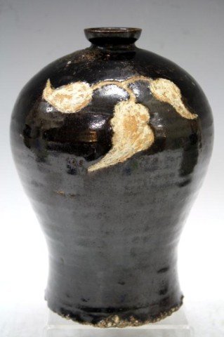 Antique Korean Iron Black Pottery Vase: A Mei Ping form porcelain vase with carved ginseng leaves design, Korea; unmarked. Dimensions: 7-1/2" H x 5" diameter