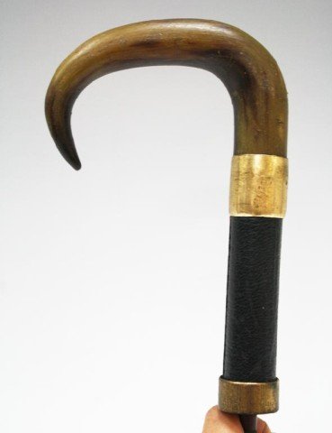 Antique Horn & Gold Overlay Cane Handle: A 9 carat rolled gold and horn cane handle; marked "NP 9ct RG". Dimensions: 9" L x 4" W (handle)