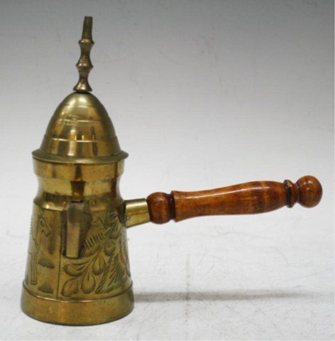Brass Creamer w/ Wooden Handle & Camel Design: A brass creamer with carved floral motif and camel, wooden handle, date and country of origin unknown; unmarked. Dimensions: 6-1/2" H x 6-1/2" L x 3-5/8" W