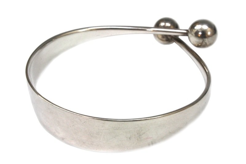 Bent Gabrielsen for Hans Hansen Sterling Bangle: A Danish, mid century, vintage sterling silver cuff bracelet with spherical ends, Denmark, circa 1960; marked 925 sterling. Dimensions: 2-5/8" diameter without ends , 3" W with end, 5/8" thickness