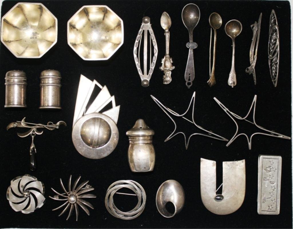 Lot of 22 Assorted Sterling Silver Pieces: A lot of assorted sterling silver pieces including a salt and pepper shaker, pins, and more. Weight and dimensions: 200 grams; 1-1/4" L - 3" L