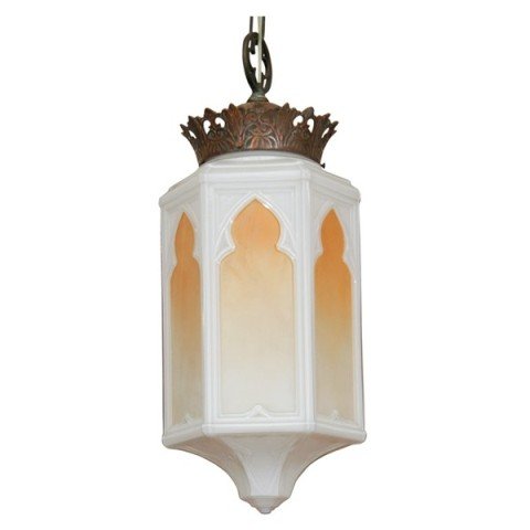 Art Deco Arabesque Milk Glass Lantern Pendant: Hanging arabesque pendant chandelier ca. 1940s with a milk glass body and vegetal motif bronze cap. The piece has stylized, colored "windows" giving the impression of a lit room within. Dimensions: 26