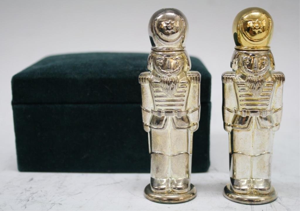 Godinger Silver Nutcracker Salt & Pepper Shakers: A pair of silver figural salt and pepper shakers, Christmas nutcracker soldiers, come with Saks Fifth Avenue box; marked Godinger Silver Art Co. Dimensions: each 4" H x 1-1/4" L x 1" W