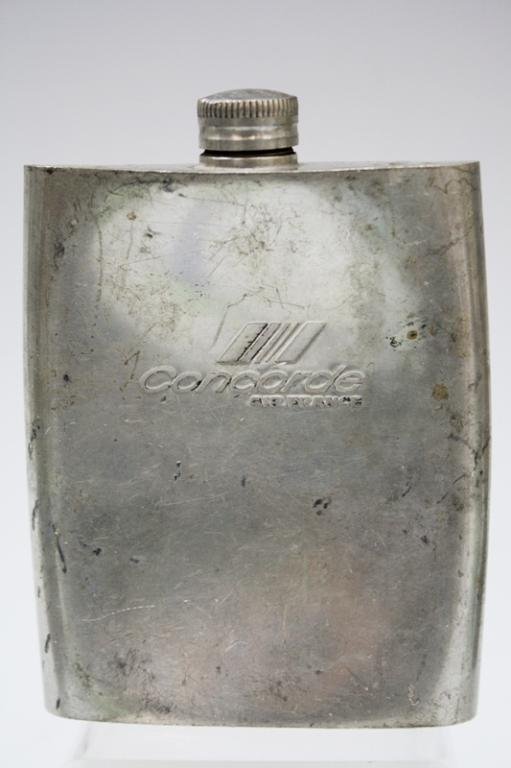 Air France Concorde Hip Flask Etains Du Manoir: Air France Concorde cognac hip flask, made by Etains du Manoir, probably pewter, France; marked. Dimensions: approximately 4-3/4"H x 3-1/4"W x 3/4"D