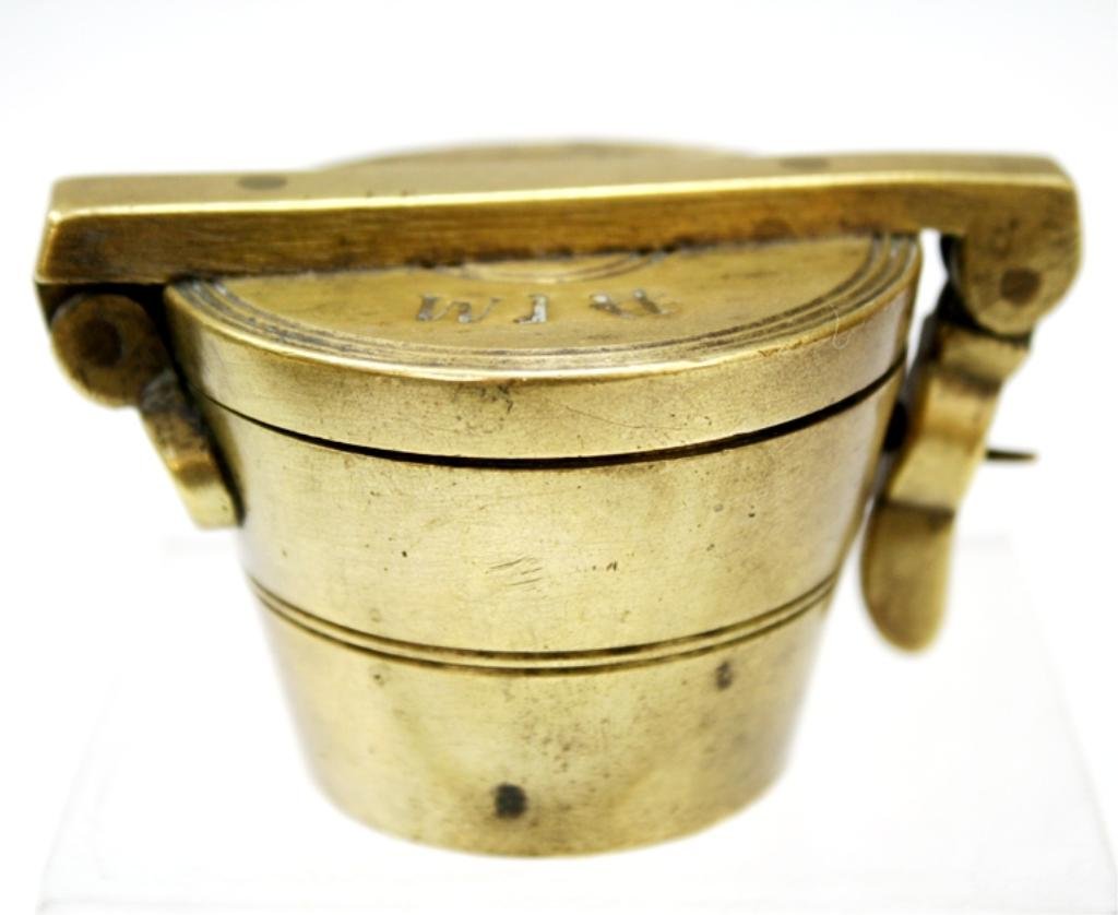 Set of 19th Century Russian Brass Weights: A set of brass weights, each weight numbered and marked with double headed romanoff eagle; cover marked and dated 1857, St. Petersburg, Russia. Dimensions: 1-3/4" H x 3" L x 2-1/8" W, smallest weight