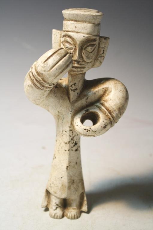 Chinese Calcified White Jade Warrior Figure: A calcified white jade warrior figure, holes in hands most likely once carried its weapon, China; marked. Dimensions: approximately 7-3/4" H x 3-3/4" L x 3" W