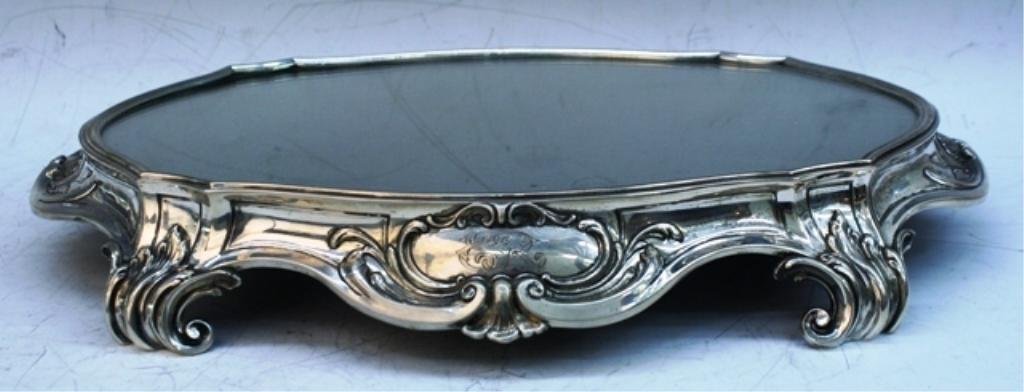 German A. Roesner Silver Centerpiece Stand: Mirrored centerpiece stand with rocaille motifs and monogram, Germany; marked "A. Roesner Dresden" and with German silver marks. Dimensions: 2-1/2"H x 17"W x 12"D
