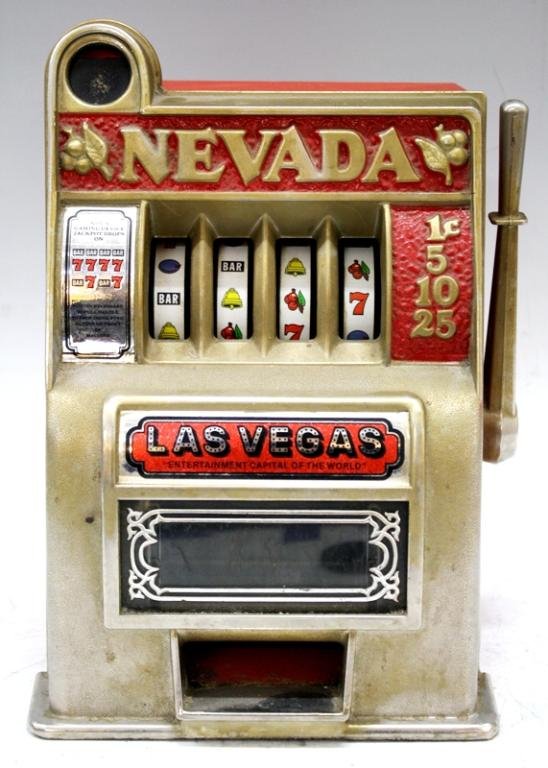 Vintage Las Vegas Coin Slot Machine: A Las Vegas metal coin slot machine; marked. Dimensions: 11" H x 8" L x 7" W