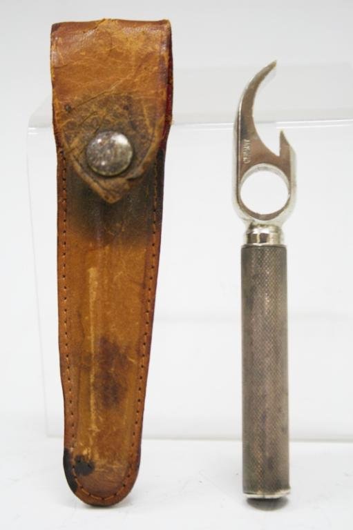 Tiffany & Co. Hoffritz Sterling Bottle Opener: A vintage Tiffany & Co. and Hoffritz, sterling silver bottle opener/ corkscrew in a possible leather pouch; marked "Germany" and "Tiffany & Co.", pouch is marked "Hoffritz Dimensions: 3-5/8" L x 1/2" 