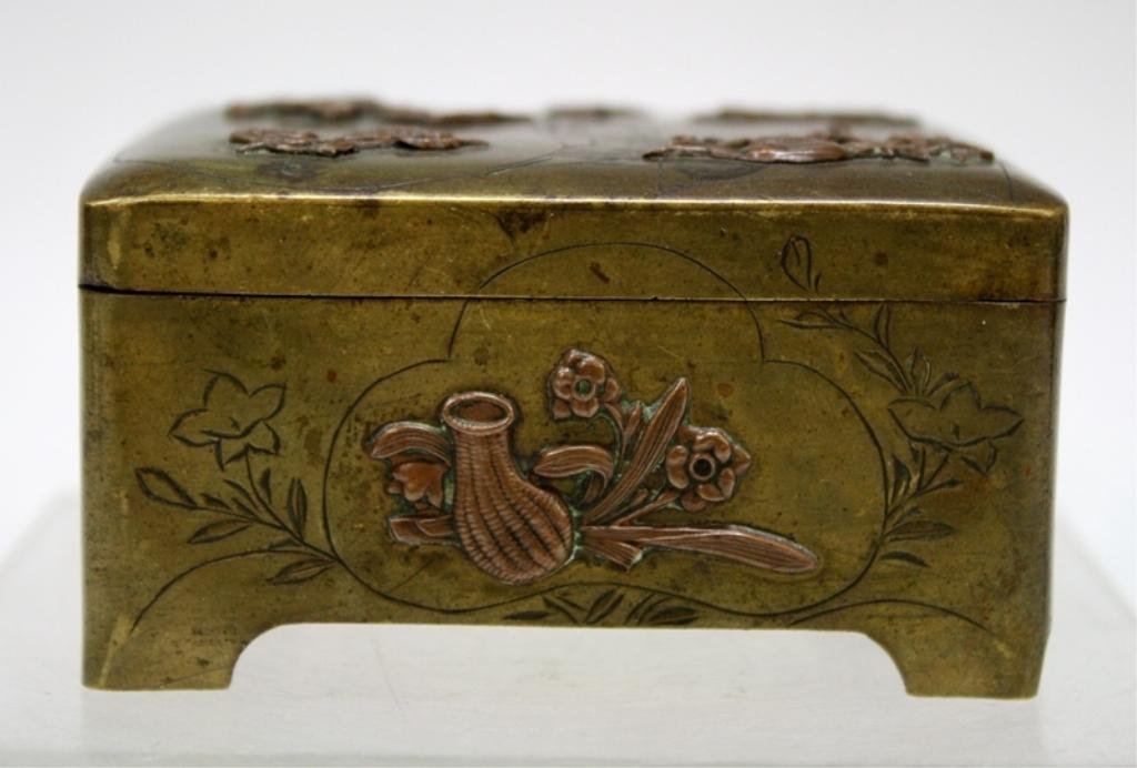Bronze & Copper Box w/ Nature Motif: A mixed metal, bronze and copper, hinged box with relief design of birds and flowers; unmarked. Dimensions: approximately 2-5/8" H x 3" L x 2-3/8" W