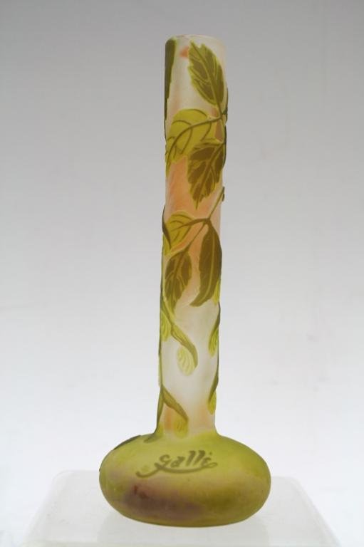 Mini Galle Cameo-Cut Glass Vase in Lemon & Green: A French Art Nouveau miniature cameo-cut long-necked glass vase by Emile Galle in lemon and green, decorated with a leaf motif, signed "Galle", France; signed. Dimensions: approximately 6-1/2" H x 2-1
