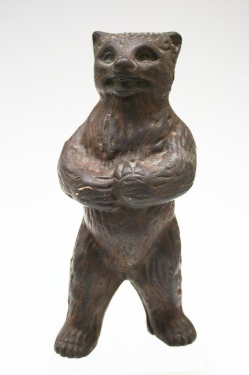 Vintage Metal Bear Bank: A vintage metal, possibly cast iron, bank in the form of a bear; marked. Dimensions: 5-3/4" H x 2-5/8" L x 2" W