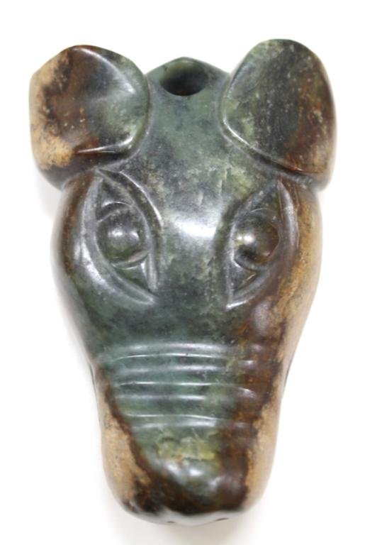 Chinese Carved Jade Cow Head: A large carved jade sculpture of a monkey riding a horse, visual pun for promotion in official rank, China; unmarked. Dimensions: 5-1/2" H x 4" L x 1-1/2" W