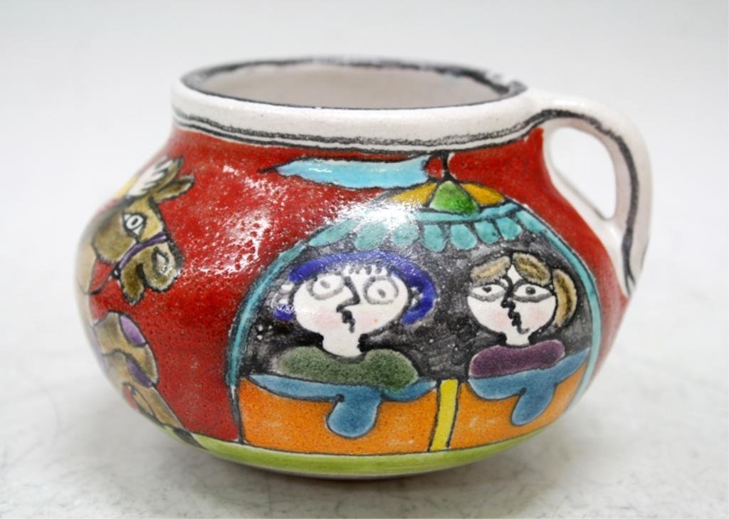 Italian Giovanni DeSimone Ceramic Vase: A hand painted underglaze pottery vase with handle and colorful, figural scene, Italy, circa 1950-1960s; signed. Dimensions: approximately 3-1/4" H x 5" L x 4-1/2" diameter