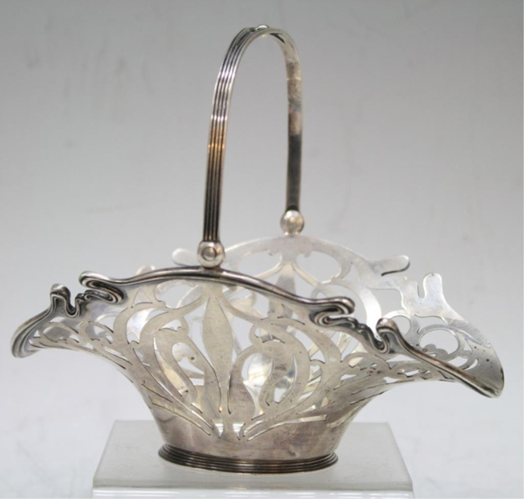 Art Nouveau Wright Kay Sterling Basket: A Wright Kay & Co. sterling basket with articulated handle; marked. Dimensions: approximately 5-5/8" H x 6-5/8" L x 4-3/8" W, 146 grams