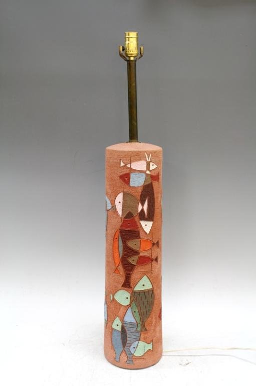 Colorful Raymor Ceramic Lamp With Fish Design: A colorful Raymor ceramic table lamp with an applied fish design; unmarked. Dimensions: 34-3/4" H x 6" diameter