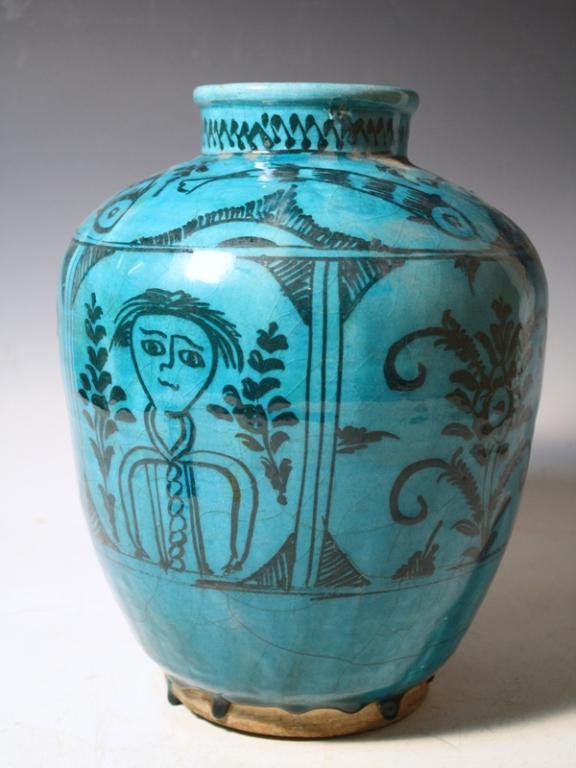 Persian Turquoise Pottery Vase w/ Fish Design: A turquoise blue glazed pottery vase with figural and fish design, possibly Persia; unmarked. Dimensions: approximately 11-5/8" H x 9-1/2" diameter
