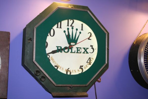 Large Commercial Rolex Wall Clock: 22 inches in diameter. Crack on the face as seen in picture. Original rebuilt electric motors.