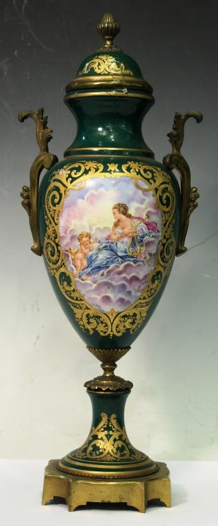 Limoges Hand-Painted & Ormolu-Mounted Urn: The forest green ground decorated on one side with an image of Venus and Cupid, on the other a pastoral landscape, both images surrounded with a profusion of gilt-painted flowers and scrolling vines, 