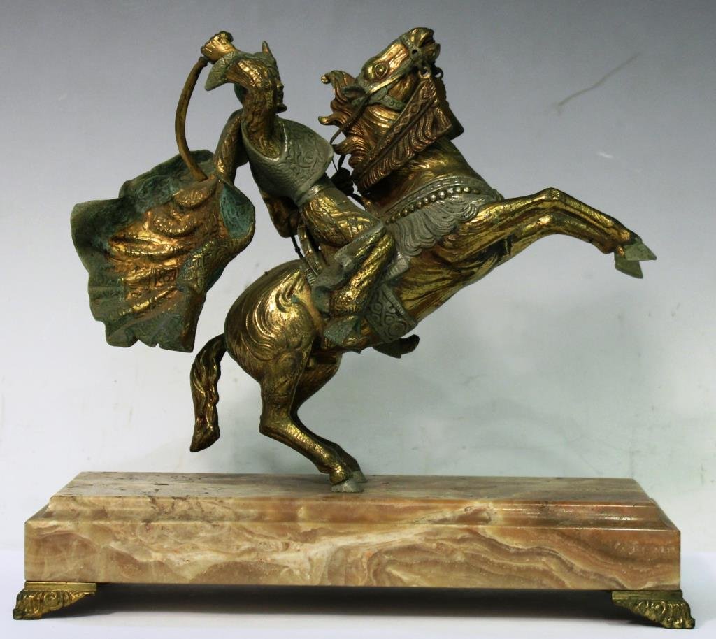 Patinated Gilt Bronze Sculpture, Moor on Horseback: Unsigned, the warrior with upraised scimitar, his horse rearing in alarm, areas of the sculpture with applied gray-green patination, now mounted on a peach, cream and gray agate base. Figure: 9" H X 1