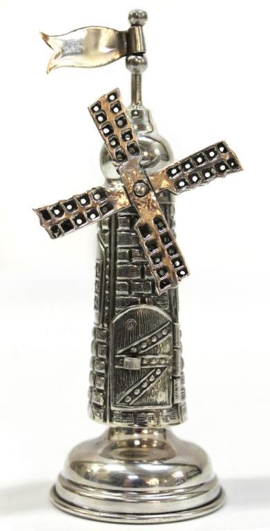 Judaica Sterling Silver Windmill-Form Spice Box: Sterling silver, depicting a windmill with an articulated swallowtail flag at top, a rotating set of four sails, elaborate chasing and repousse to the sides simulating masonry and windows, and a latch