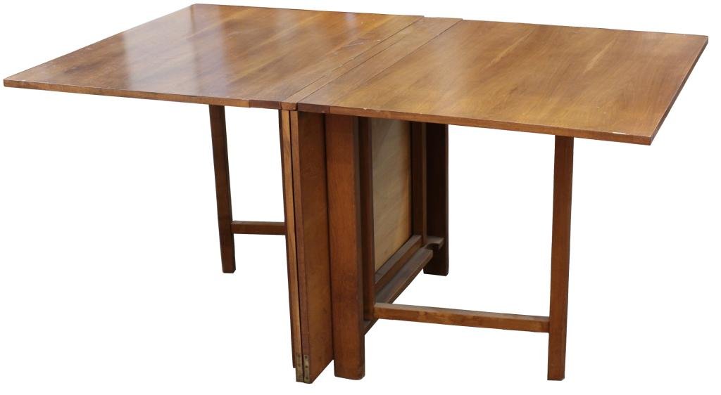 Bruno Mathsson "Maria" Teak Drop Leaf Dining Table: Sweden, 1950s, the teak top expanding to various lengths between 32" and 112", supported on birch legs, 29".H X 112" W X 39.5" D open, 10" W closed. Stains to top.
