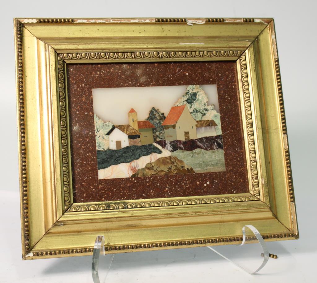 Italian Pietra Dura, Village Scene: The small panel depicting a farmstead set into a copse of trees, and with a red porphyry "mat", in a carved and gessoed gilt frame, the reverse with the label "Arte del Mosaico." Image: 3.5" H X 5" W;