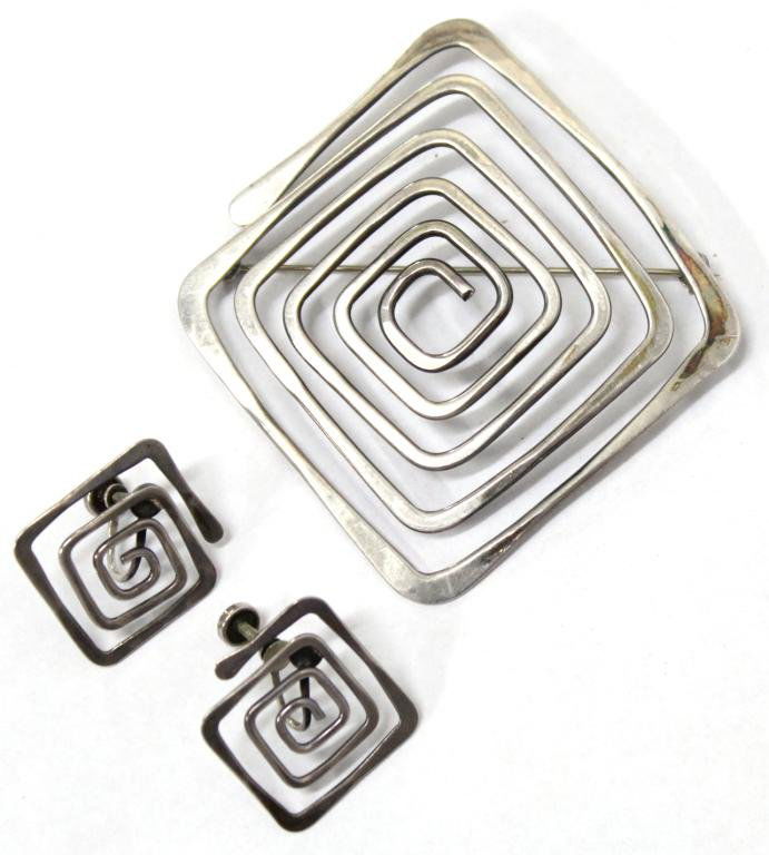 Ed Wiener Sterling Spiral Earring & Brooch Set: Sterling silver, circa 1940s-50s, the Mid-Century Modern suite comprising a pair of screw-back earrings and a large brooch, each mounting a squared spiral of flattened silver wire, the earrings a true