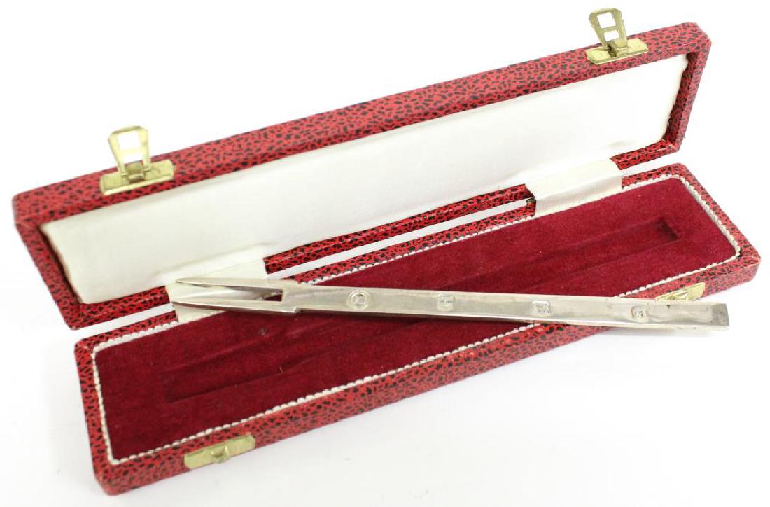 English Sterling Silver Barware, Olive Fork with Zester: The Mid-Century Modern two-tined fork with a zester at handle's end, which is stamped with Sheffield sterling marks, a 1973 "E" date mark, and the "FH" maker's mark of Francis Howard, active second ha