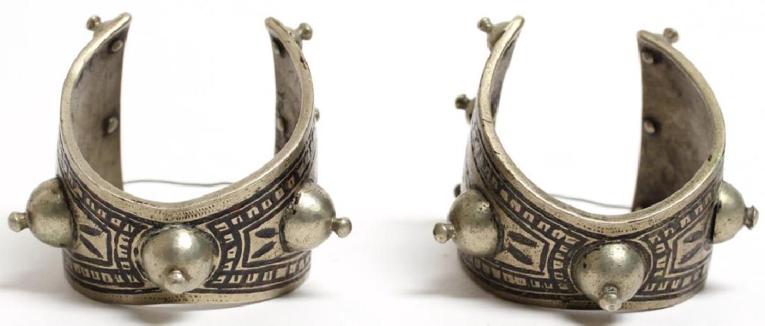 Pair of Tribal Wide Cuff Bracelets: With incised and etched designs. 2.75" W. Property from the estate of the renowned belly dancer Serena Wilson.