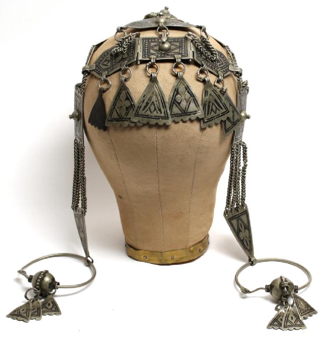 North African Tribal Chain Metal Headdress: With structured center of circular and triangular metal mounts with incised and etched patterns. 31" L. Property from the estate of the renowned belly dancer Serena Wilson. Property from the estate of