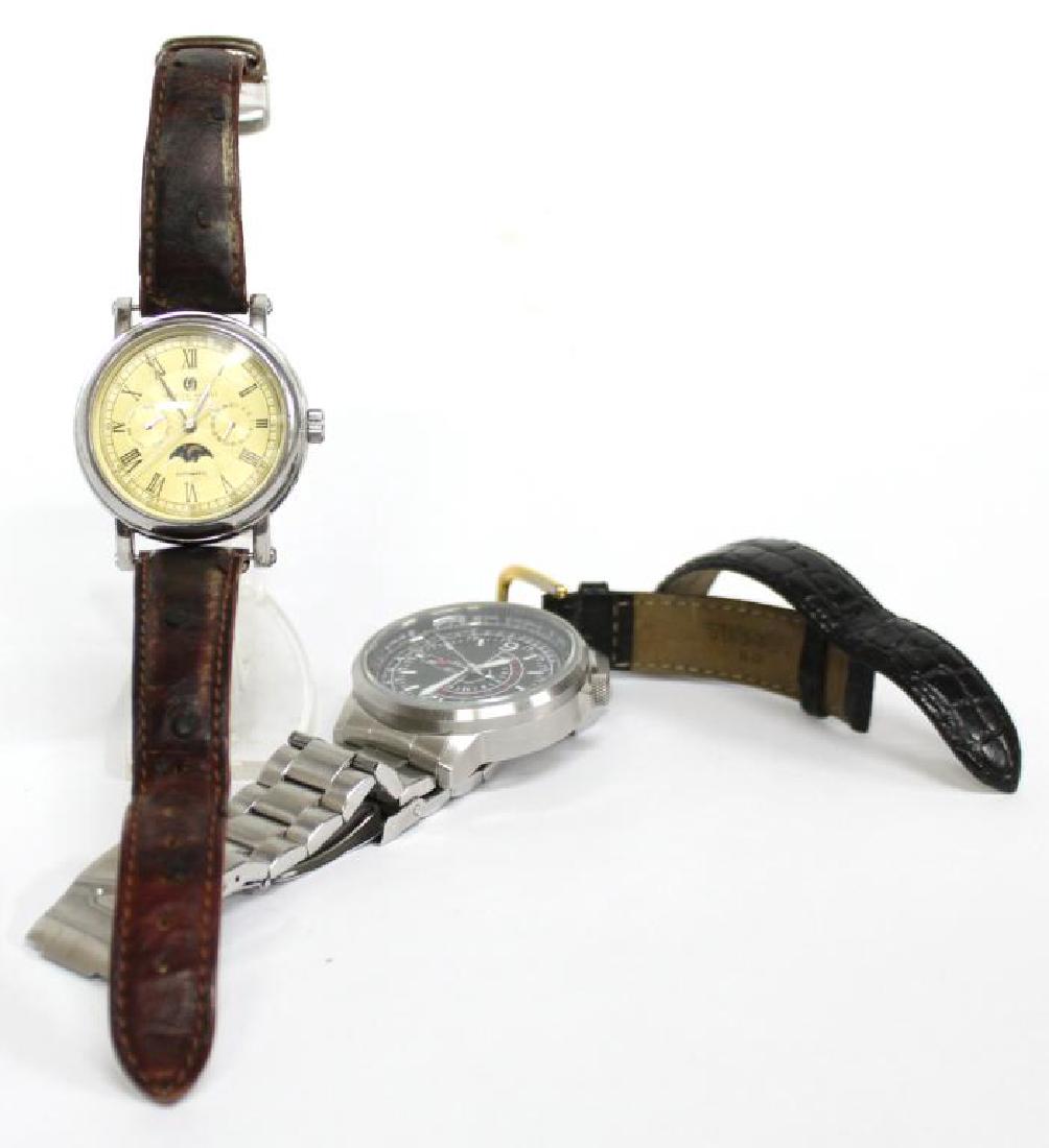 2 Multifunction Stainless Steel Watches: Invicta model 5747, and Charles-Hubert example, both marked; together with an extra leather band. Larger: 1.75" diameter; 7.5" L. Charles-Hubert with a minor scratch to crystal, and worn strap.