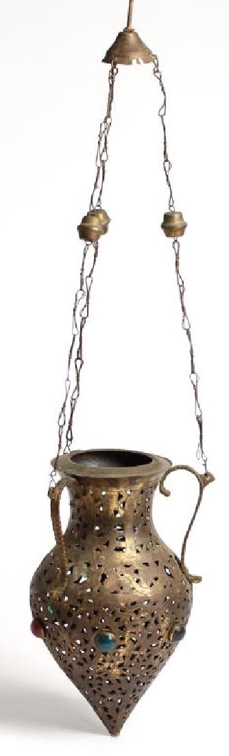 Moroccan Jeweled Glass Incense Burner: Vasiform, with pierced motif of intricate arabesques with three applied handles. 28.5" L. Property from the estate of the renowned belly dancer Serena Wilson.