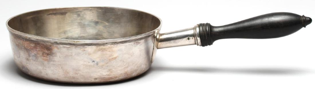 French Silver Saucer, Circa 1780-1809: Of rounded form with ebony handle, bearing partial French hallmarks and unknown "JEC" maker's mark. 13.25" L X 7" diameter. Approx. 12.1 ozt. total including wood handle.