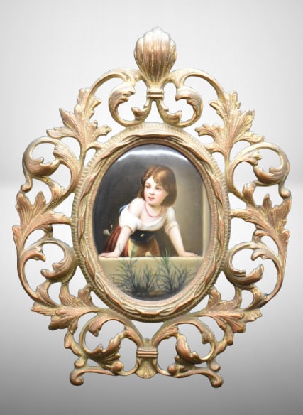 Small Framed KPM plaque, child peerng over, ornate brass framework: Small Framed KPM plaque, child peerng over, ornate brass framework; Plaque measures, 5" x 3.5", overall 11" tall