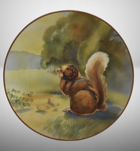 Mrkd. Nippon 10.5"d hanging plaque plate w/ blown-out squirrel: Mrkd. Nippon 10.5"d hanging plaque plate w/ blown-out squirrel;