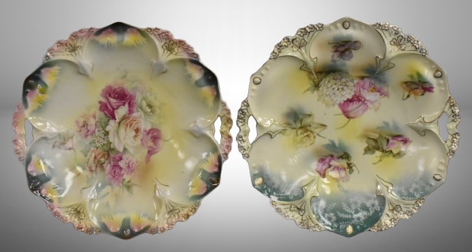 (2) R.S. Prussia Mold 82 11"d cake plates, both have nice floral designs, circle mold marks + 1 w/: (2) R.S. Prussia Mold 82 11"d cake plates, both have nice floral designs, circle mold marks + 1 w/ red mark;