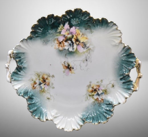 Handpainted porcelain 12"d cake plate, multi-colored flowers: Handpainted porcelain 12"d cake plate, multi-colored flowers; seashell-like mold