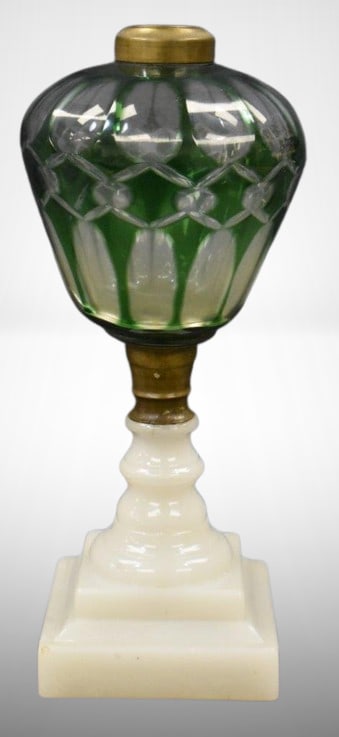 Emerald green cut-to-clear kerosene lamp on white marble stand (1 of 12)