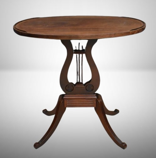 Duncan Phyfe Lyre side/ lamp table: Duncan Phyfe Lyre side/ lamp table; oval top meas. 26" x 17" x 2'1" tall; **BROWN AUCTION WILL NOT SHIP THIS ITEM. BUYER MUST PICK UP FROM GREENSBURG, KS BEFORE JAN. 31ST OR ARRANGE THEIR OWN SHIPPING