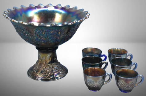 Fenton Carnival Glass Orange Tree punch bowl set, cobalt; 9"h bowl and base, (6) cups. Please use: Fenton Carnival Glass Orange Tree punch bowl set, cobalt; 9"h bowl and base, (6) cups. Please use pictures as part of the description. Brown Auction attempts to call any flaw that can affect the value