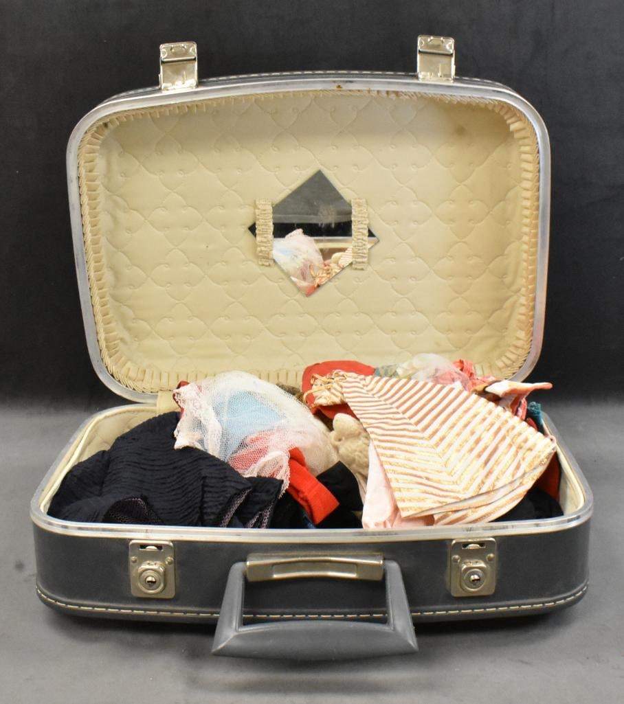 Small suitcase full of mainly Barbie clothes, some store bought and some handmade; . Please use: Small suitcase full of mainly Barbie clothes, some store bought and some handmade; . Please use pictures as part of the description. Brown Auction attempts to call any flaw that can affect the value o
