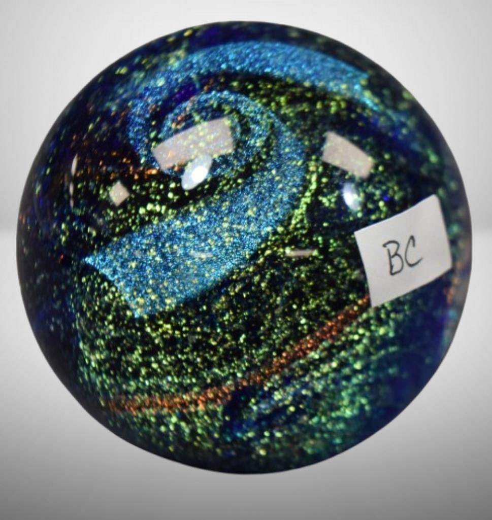 Glass Eye Studio Northern Lights paperweight: Glass Eye Studio Northern Lights paperweight; 3" tall. Please use pictures as part of the description. Brown Auction attempts to call any flaw that can affect the value of each piece. It is the buyer'