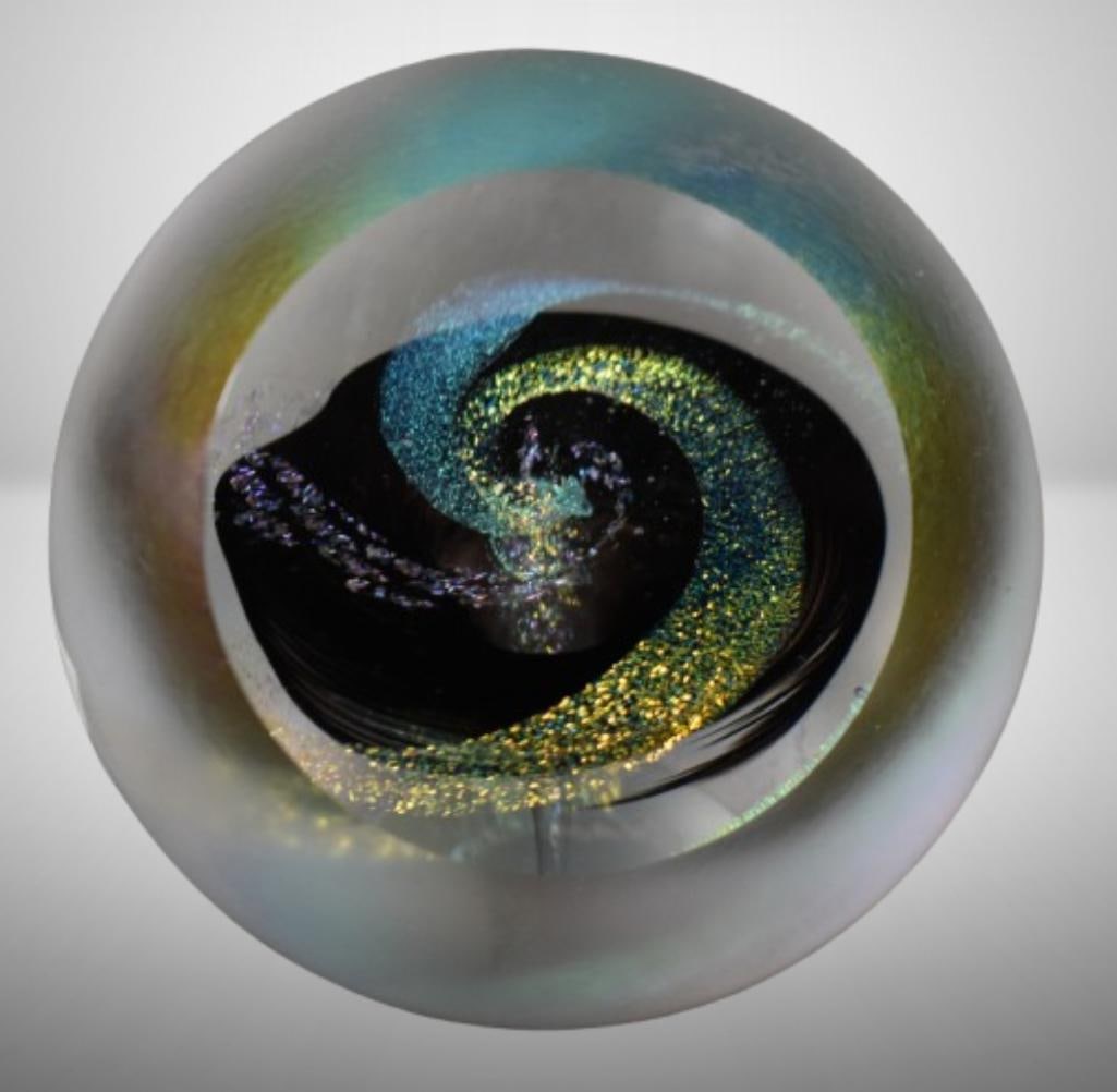 Glass Eye Studio Black Hole paperweight: Glass Eye Studio Black Hole paperweight; 3.25" tall. Please use pictures as part of the description. Brown Auction attempts to call any flaw that can affect the value of each piece. It is the buyer's