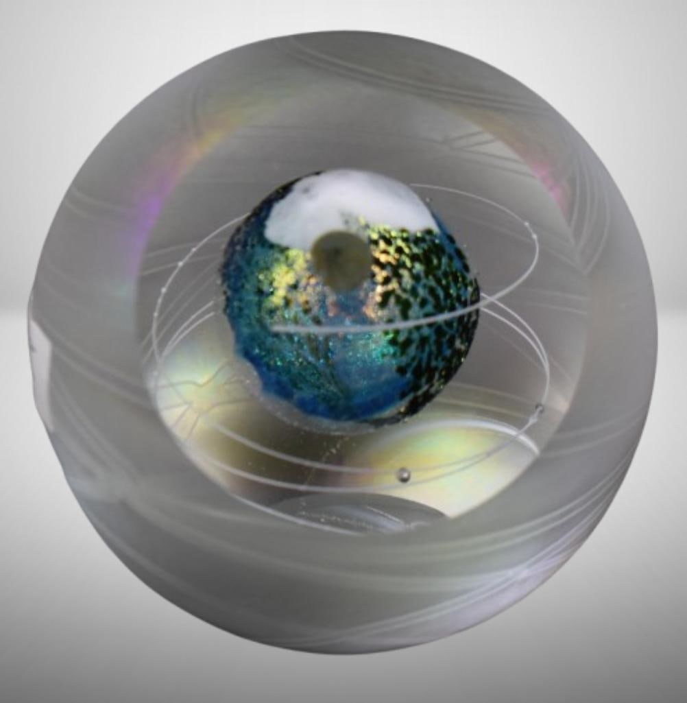 Glass Eye Studio Lunar Orbit paperweight: Glass Eye Studio Lunar Orbit paperweight; 3.25" tall. Please use pictures as part of the description. Brown Auction attempts to call any flaw that can affect the value of each piece. It is the buyer's
