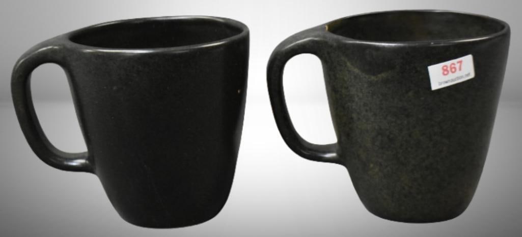 (2) Roseville Raymor 179 coffee tumblers, green: (2) Roseville Raymor 179 coffee tumblers, green; . Please use pictures as part of the description. Brown Auction attempts to call any flaw that can affect the value of each piece. It is the buyer's re