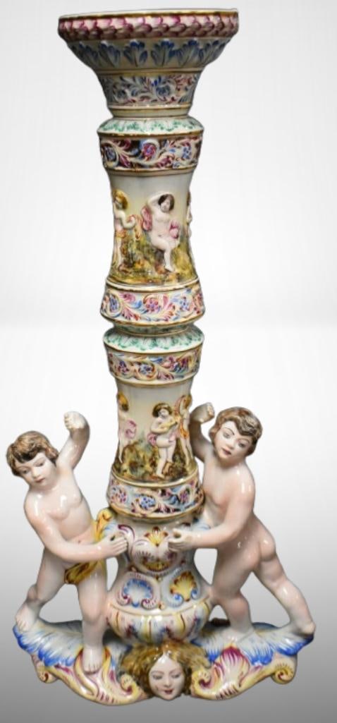 Mrkd. Capodimonte/ Made in Italy elaborately decorated 40" fern plant stand: Mrkd. Capodimonte/ Made in Italy elaborately decorated 40" fern plant stand; 2 cherubs dancing around column of figures cavorting. Please use pictures as part of the description. Brown Auction attempt