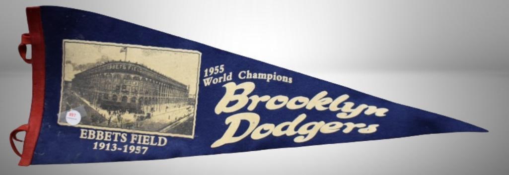 1955 World Champions Brooklyn Dodgers felt pendant: 1955 World Champions Brooklyn Dodgers felt pendant; 30"l. Please use pictures as part of the description. Brown Auction attempts to call any flaw that can affect the value of each piece. It is the buy