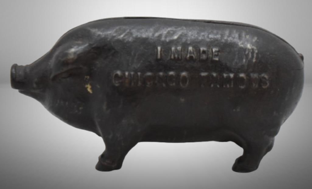 Cast Iron "I Made Chicago Famous" pig bank, mrkd. Copyright 1902: Cast Iron "I Made Chicago Famous" pig bank, mrkd. Copyright 1902; 5.5"l x 2.5" tall; Items as pictured